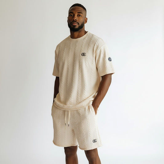 Klothco beige cable-knit short sleeve shirt and shorts set worn by a man, featuring a relaxed fit and logo details.