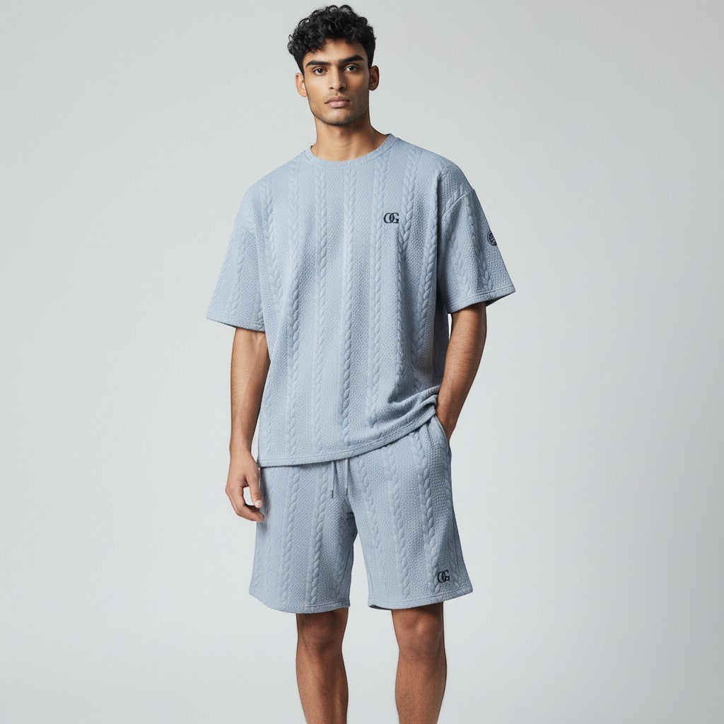 Klothco light blue cable-knit short sleeve shirt and shorts set worn by a male model against a neutral background.
