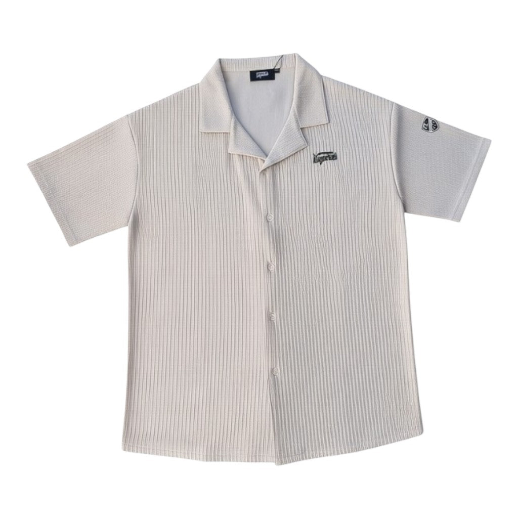 Klothco Kaporal beige short-sleeved button-down shirt with vertical ribbing, camp collar, and embroidered logo patch.