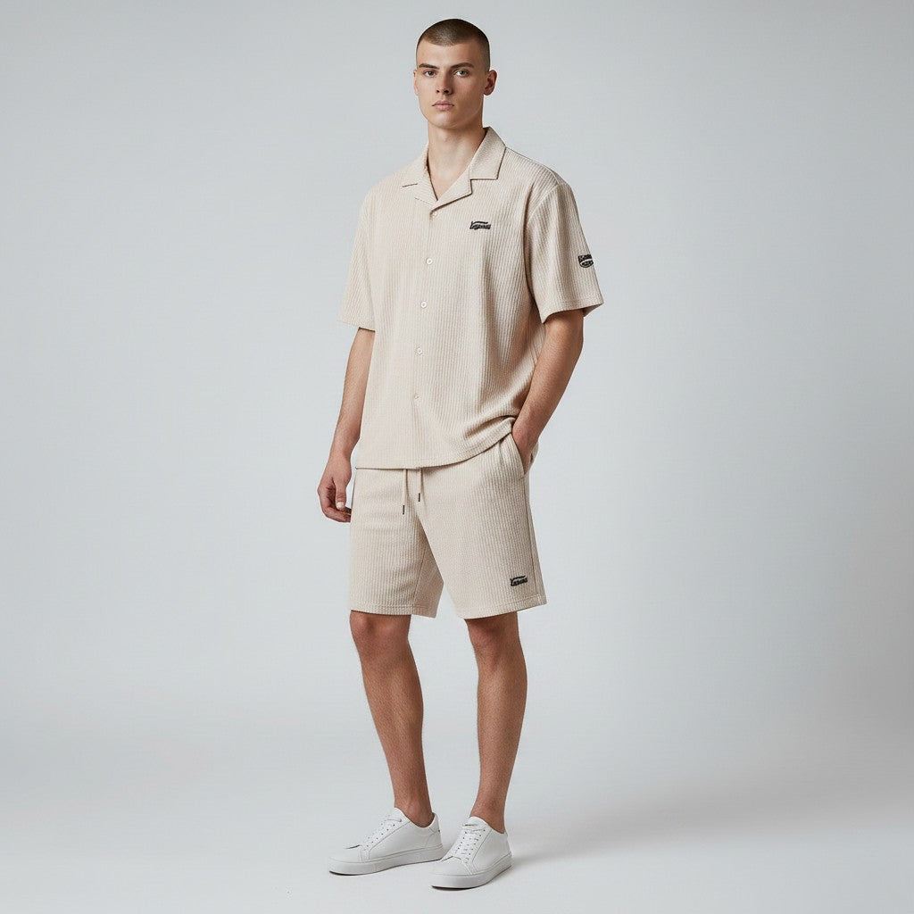 Klothco Kaporal beige textured short-sleeve shirt and drawstring shorts set worn by a male model.