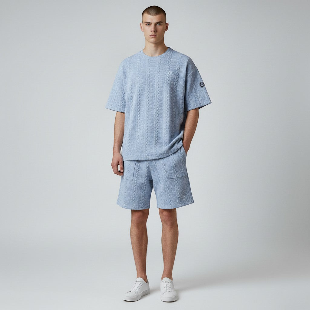 Klothco light blue cable-knit short sleeve shirt and shorts matching set worn by a male model with white sneakers.